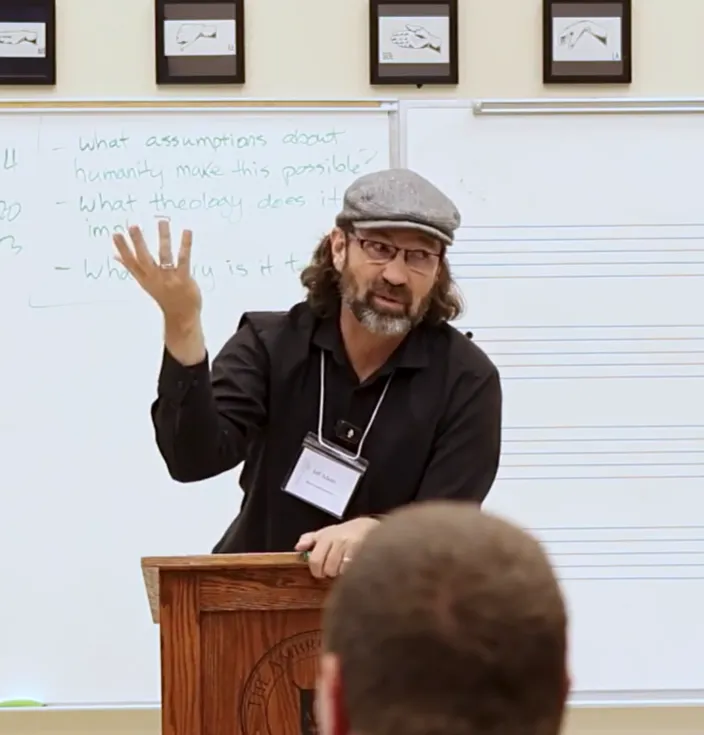A presenter speaks to teachers from a podium at Boot Camp